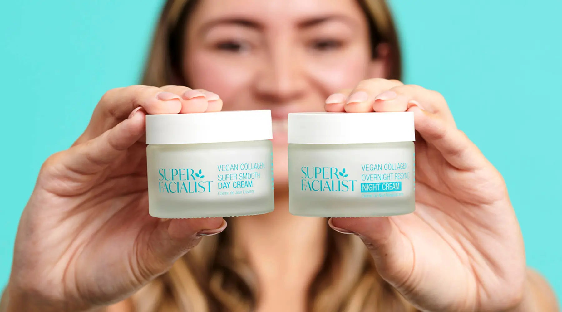 woman holding vegan collagen day and night cream jars towards the camera